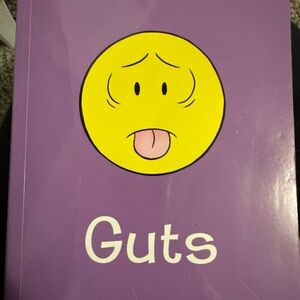 Purple 'Guts' Book with Yellow Emoji